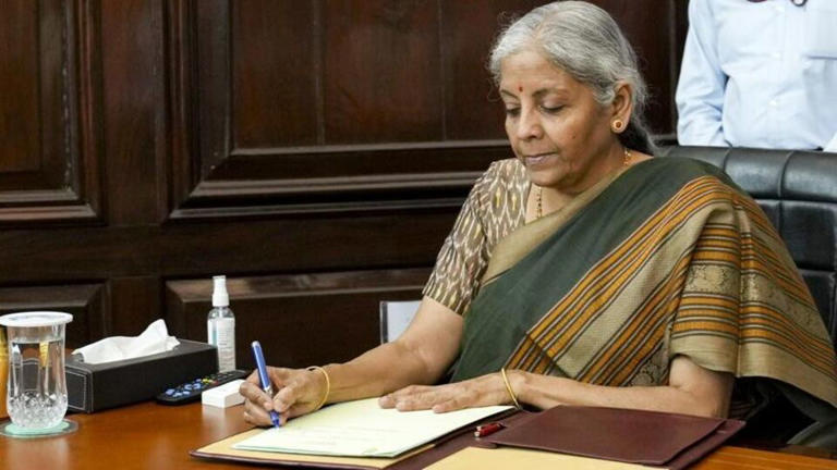 Finance Minister Nirmala Sitharaman receives dividend from SBI