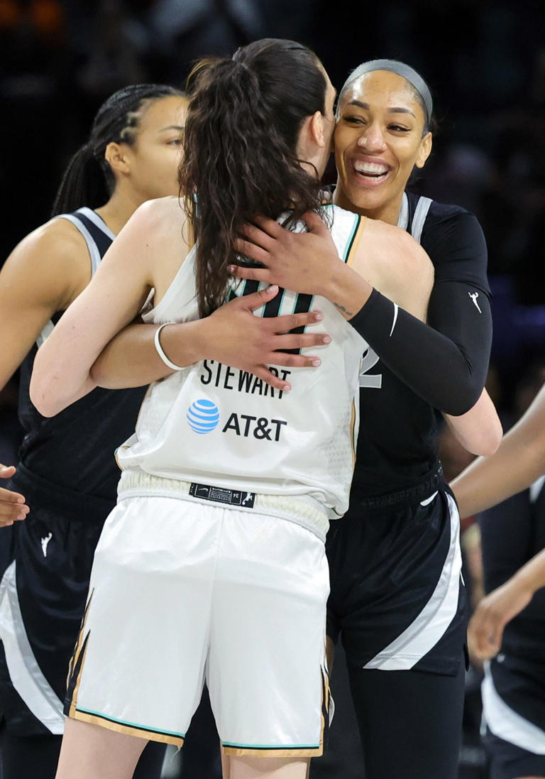 A’ja Wilson of the Las Vegas Aces and fellow Olympian teammate Breanna Stewart of the New York Liberty hugging at midcourt before their game Getty Images
