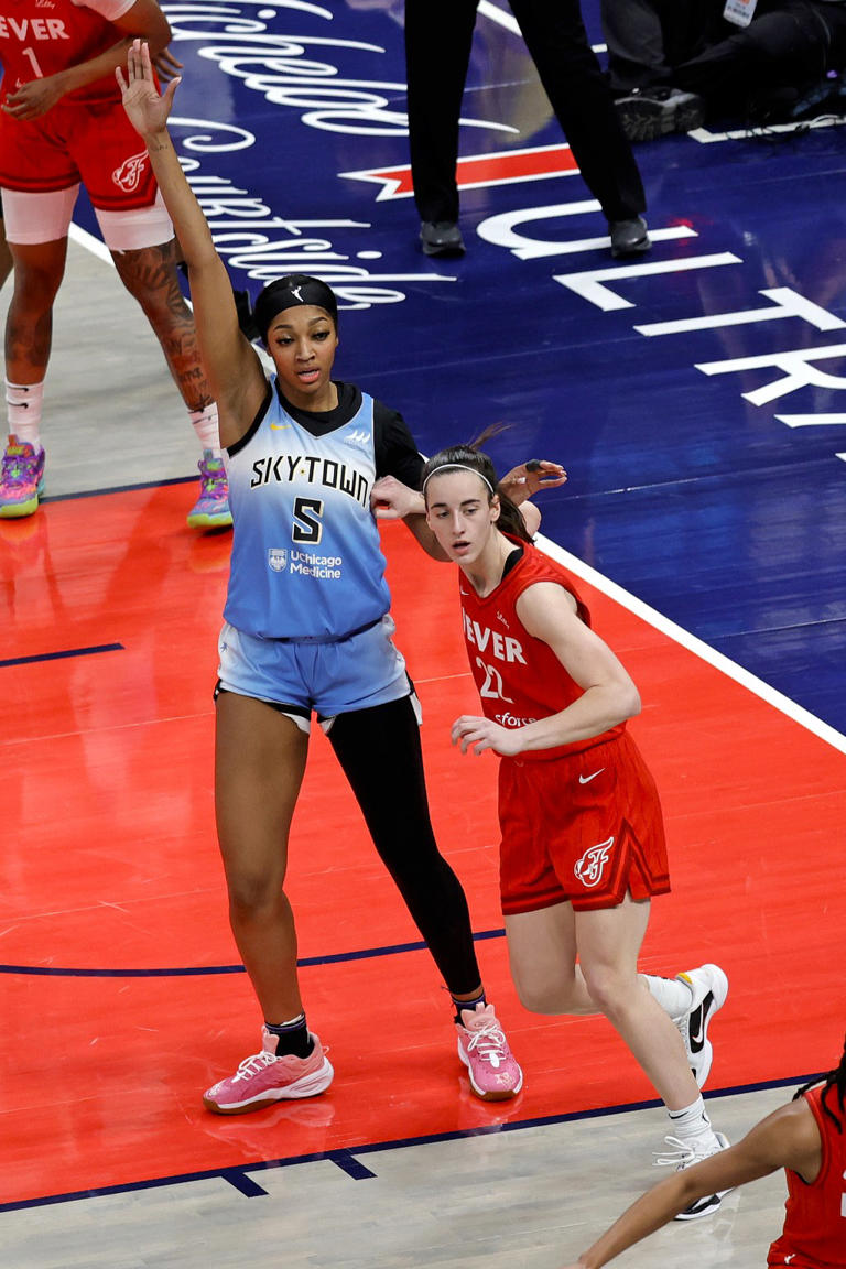 Chicago Sky forward Angel Reese being guarded by Indiana Fever guard Caitlin Clark. Icon Sportswire via Getty Images