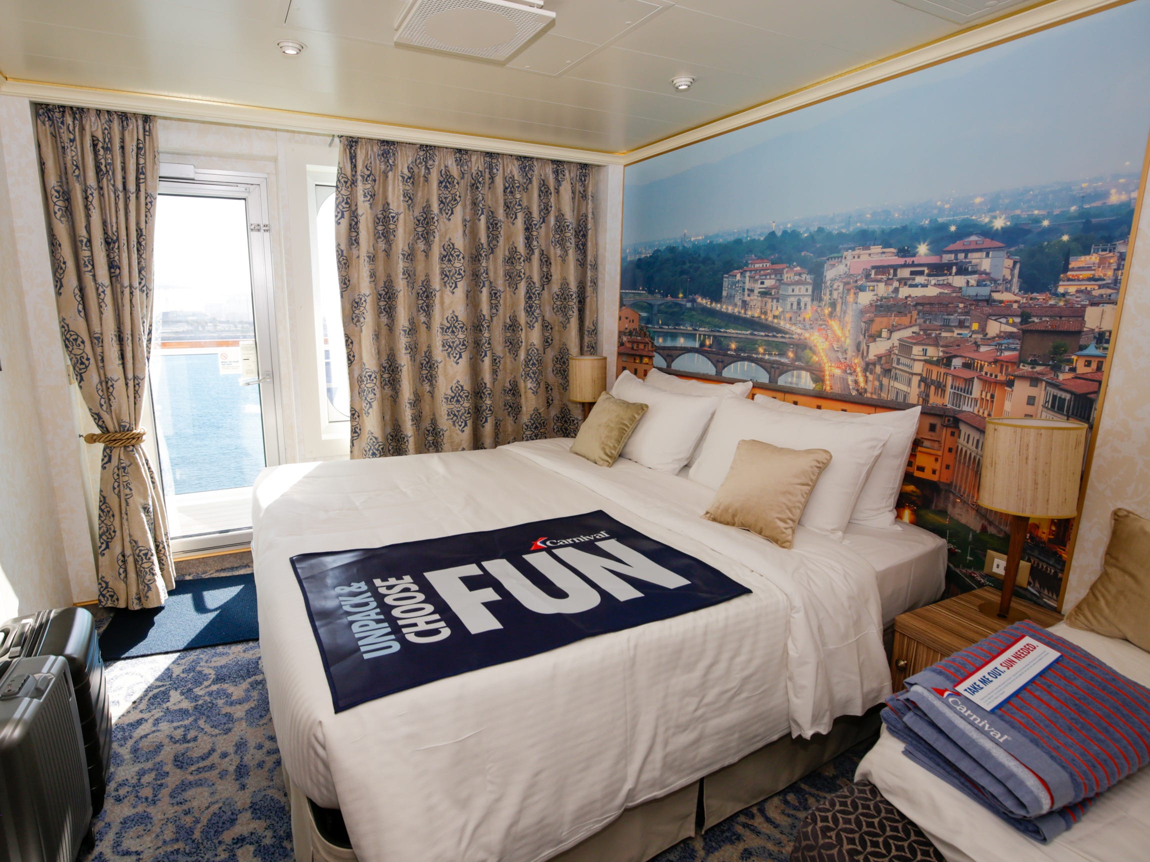 <p><span>The cabin is </span><a href="https://help.goccl.com/app/answers/detail/a_id/9171/~/carnival-firenze-%28fn%29-stateroom-dimensions"><span>72 square feet</span></a><span> larger than my interior one. But don't expect to starfish here: The narrow layout and furniture didn't leave much room to spare.</span></p><p><span>Our four-person family could comfortably lounge in my interior room. Four people inside the balcony cabin required flexible maneuvering around each other and the furniture.</span></p>