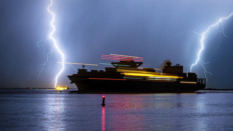 A cruise ship is seen with lightning. Cruise Ship bad weather Lead JS 092622