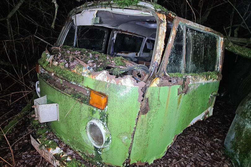 inside abandoned hoarder house with land covered in cars, campervans and boat