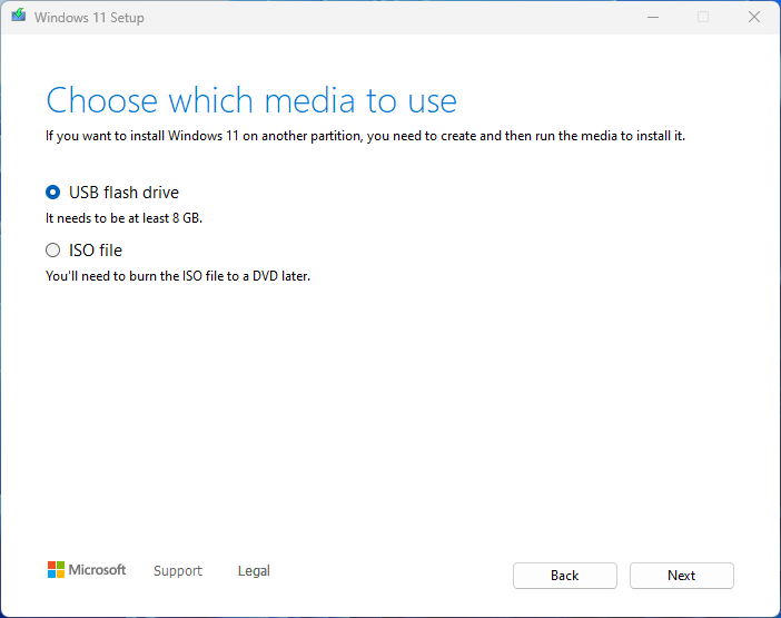 Screenshot of the Windows 11 Media Creation Tool showing options to use a USB flash drive or ISO file as installation media