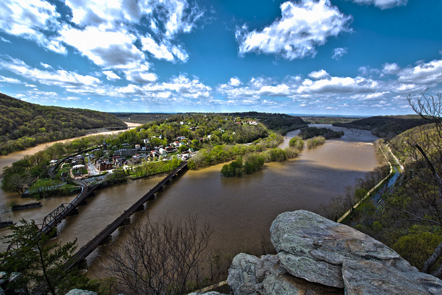 <p>Harper's Ferry has a strong place throughout much of American history. Here, Robert Harper set up passage over the Potomac, helping settle the Shenandoah Valley. Here, Washington proposed the site for the second armory and arsenal in the country. Here in 1859, John Brown raided that arsenal, attempting to initiate an armed slave revolt.</p> <p>Because of its strategic location and railroad, the Union and Confederacy battled for control, with the town changing hands eight times between 1861 and 1865. It was a staging ground for Lee's attempted invasion of Maryland that led to the battle of Antietam, but it was also hotly contested in the years that followed.</p>