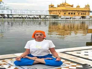 complaint filed against fashion designer for performing yoga at golden temple