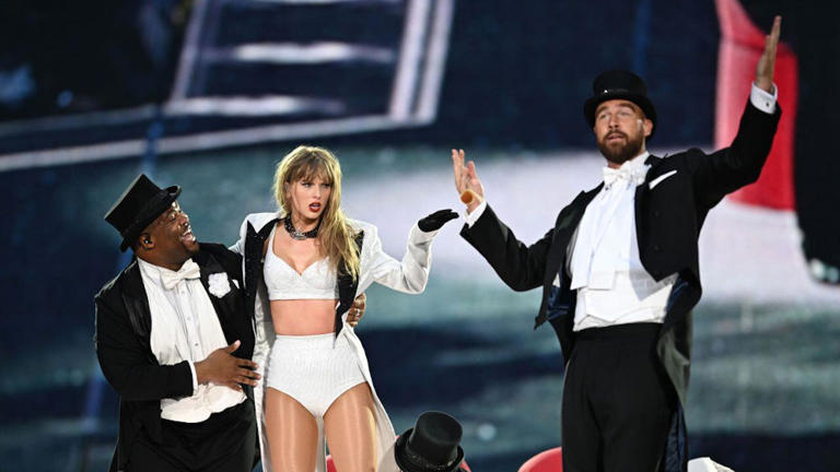 Travis Kelce, right, was a surprise performer during Taylor Swift's concert at London's Wembley Stadium on Sunday.