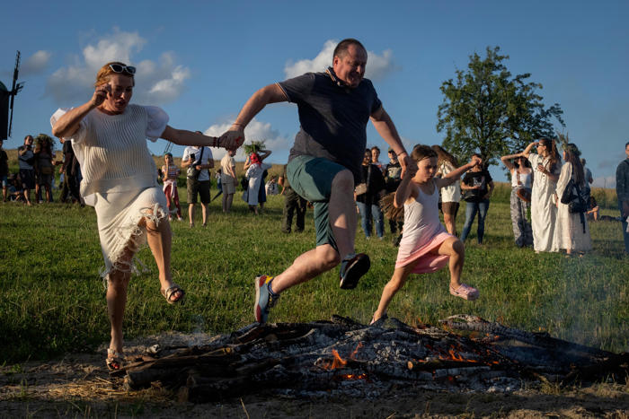 thousands of ukrainians mark pagan festival with bonfire jumping and air raid notifications