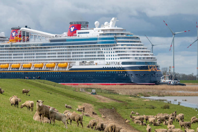 Disney Cruise Line's new ship Disney Wish travels on the Ems River from the Meyer Werft shipyard on its way to sea trials in the North Sea on March 30, 2022.