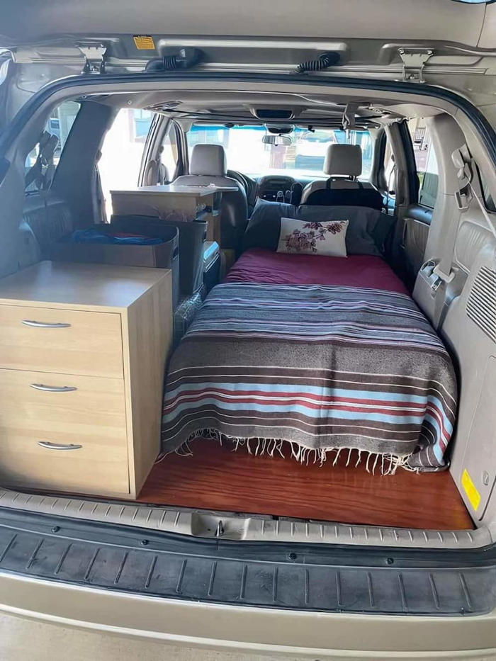watch: man shares picture of how the back of a car turned into a bedroom