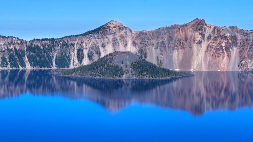 <p>Oregon’s only National Park, Crater Lake, is a must-visit destination. Its impossibly blue waters, stunning mountain scenery, and opportunities to explore the unique natural landscapes of this area make this worthy of stop any time you’re in the area.</p><p>If you want the ultimate national park experience, try booking a room at the historic Crater Lake Lodge. Here, you can spend the night in one of their cozy rooms, wake up to one of the best views in the entire region, while enjoying your morning coffee.</p>