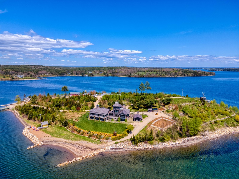<p>Strum Island consists of nearly 10 acres of land, providing a tranquil and private setting just minutes from the mainland. The island features a main lodge with 9,500 square feet of living space, a boathouse, a beach hut, and staff quarters, among other structures.</p> <p>Each building is equipped with its own security system and multiple security cameras, ensuring peace of mind for the residents. The island’s many other features include a year-round greenhouse, vegetable gardens, orchards, berry and herb gardens, and even a Lobster Temple for cooking and entertaining.</p>