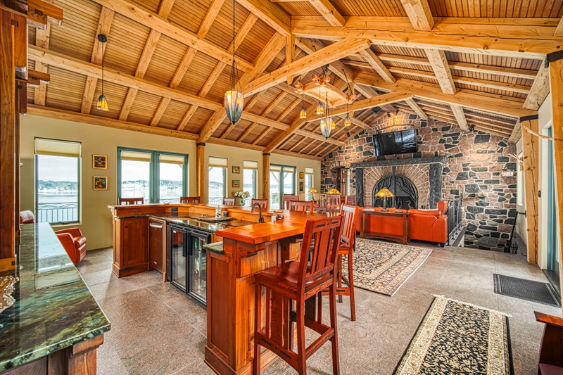 <p>Spanning a little over 9,500 square feet, the main lodge consists of 6 bedroom suites, an massive great room, a formal dining area that looks like it could easily fit two dozen guests, a fully equipped kitchen, and plenty of space to entertain guests.</p>