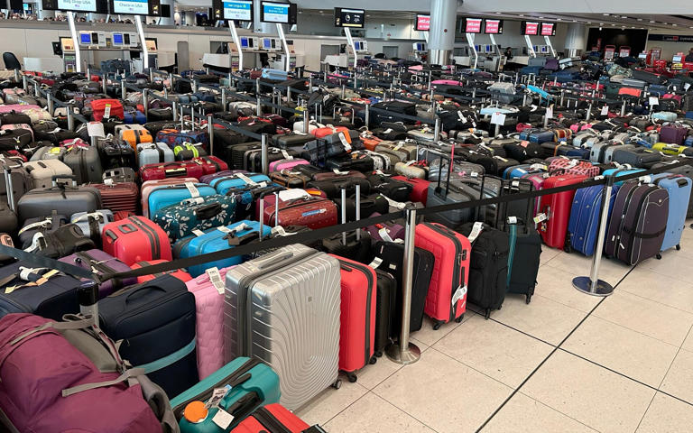 Luggage piled up in terminals one and two of Manchester Airport following the power cut