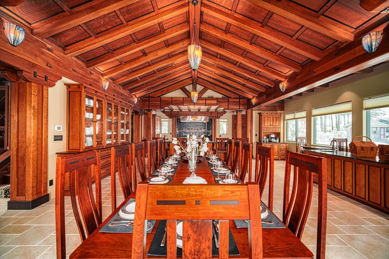 <p>The great room features a hand-carved walnut bar with a hammered copper sink and <a href="https://www.fancypantshomes.com/my-fancy-home/most-beautiful-tiffany-style-floor-lamps/">Tiffany-style lighting</a>. The lodge’s kitchen is equipped with dual Lacanche gas ranges and ovens, perfect for preparing gourmet meals.</p> <p>The top floor houses an observatory offering spectacular 360-degree views with a traditional lighthouse-inspired Widow’s Walk above it (<a href="https://www.fancypantshomes.com/celebrity-homes/taylor-swifts-house-from-the-last-great-american-dynasty/">Taylor Swift’s Rhode Island house</a> has one as well).</p>