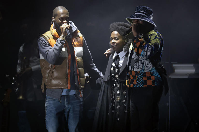 Lauryn Hill, center, is joined by Pras Michel, left, and Wyclef Jean, right, during the Roots Picnic Philadelphia at The Mann in Fairmount Park on June 3, 2023.