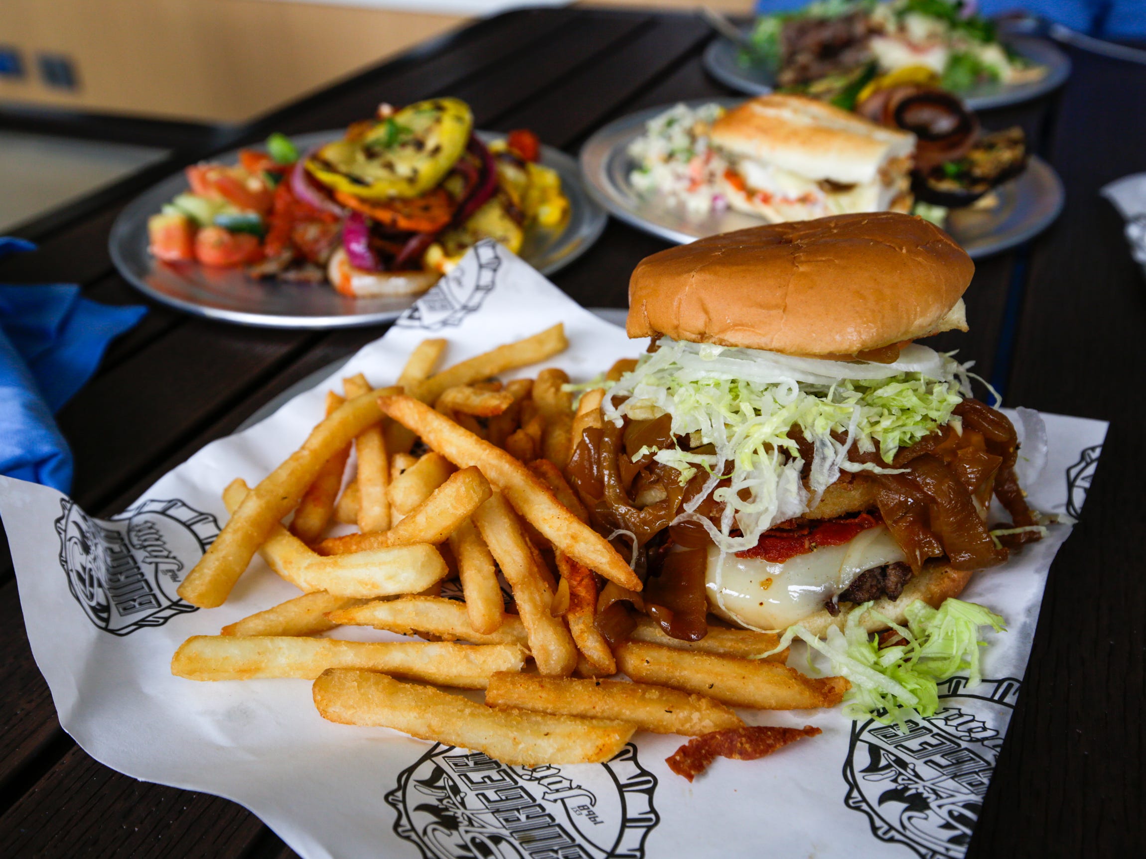 <p>The Guy Fieri-branded burger joint accrued lines before it opened for lunch. I, drawn to hyped food places like a moth to a light, was excited by its popularity.</p><p>Unfortunately, I couldn't enjoy it for long. I hit a food coma about four bites into the decadently greasy pepperoni pizza burger, served with a thick slab of fried mozzarella.</p>