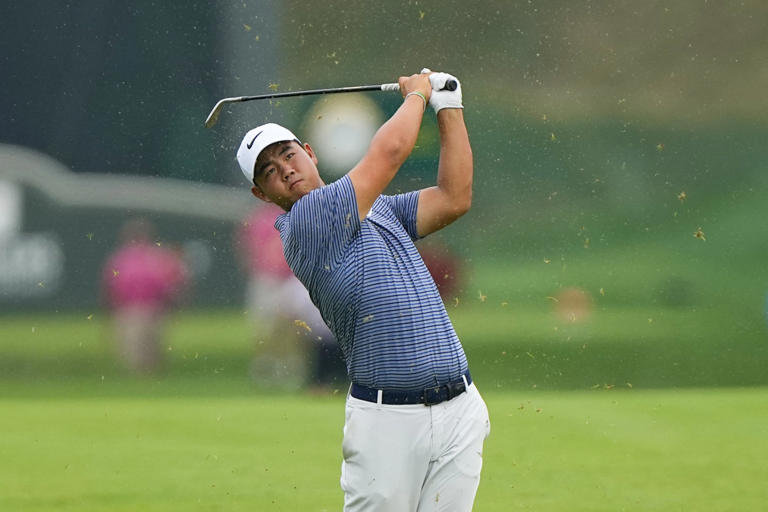 Jun 23, 2024; Cromwell, Connecticut, USA; Tom Kim hits the ball in the fairway of the eighteenth hole during the playoff round of the Travelers Championship golf tournament at TPC River Highlands. © Gregory Fisher-USA TODAY Sports