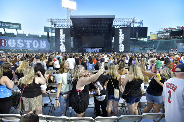 Concert goers awaited the beginning of the New Kids on the Block concert at Fenway Park in August, 2021.