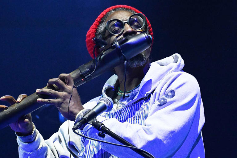 Scott Kowalchyk/CBS/Getty André 3000 performing during The Late Show with Stephen Colbert on January 23, 2024
