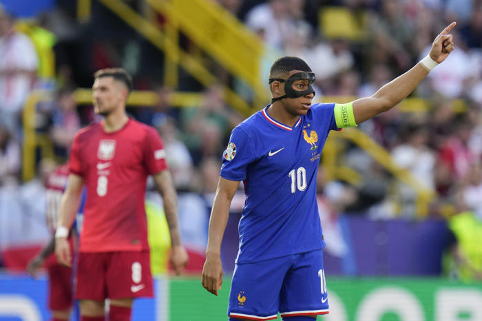 kylian mbappé scores but encounters issues wearing protective mask on return for france at euro 2024