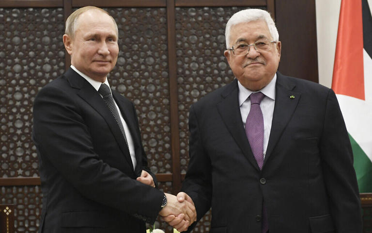 File - Palestinian Authority President Mahmoud Abbas, right, shakes hands with Russian President Vladimir Putin, during a meeting in Bethlehem, January 23, 2020. (Alexander Nemenov, Pool via AP)