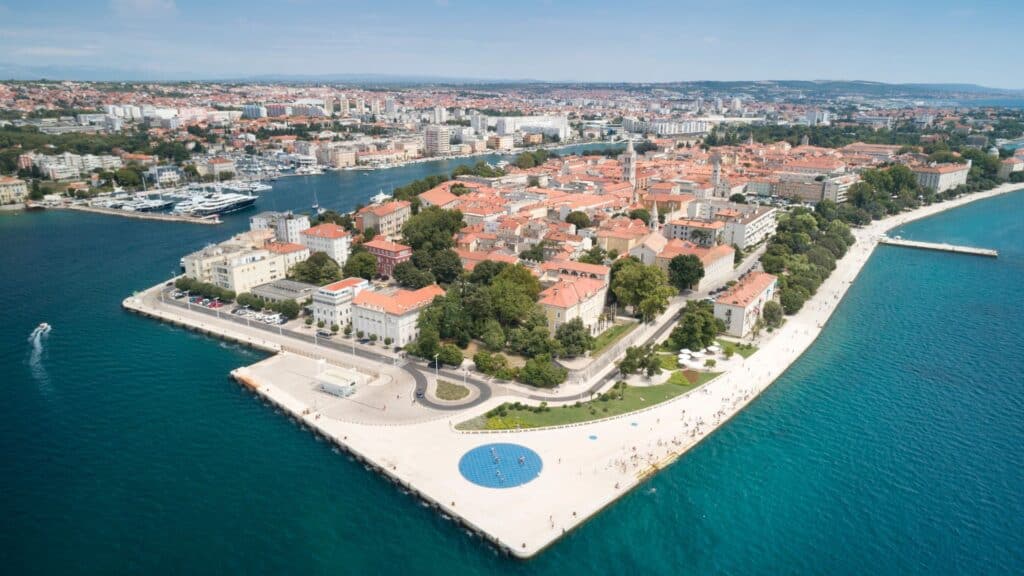 <p>Zadar is a city that perfectly blends history with modern attractions. The old town has Roman and Venetian ruins, including the impressive St. Donatus Church. Don’t miss the unique Sea Organ, an architectural sound art object that creates music from the sea waves. The nearby Greeting to the Sun installation is a beautiful spot to watch the sunset. Zadar’s lively atmosphere and rich history make it a captivating destination.</p>