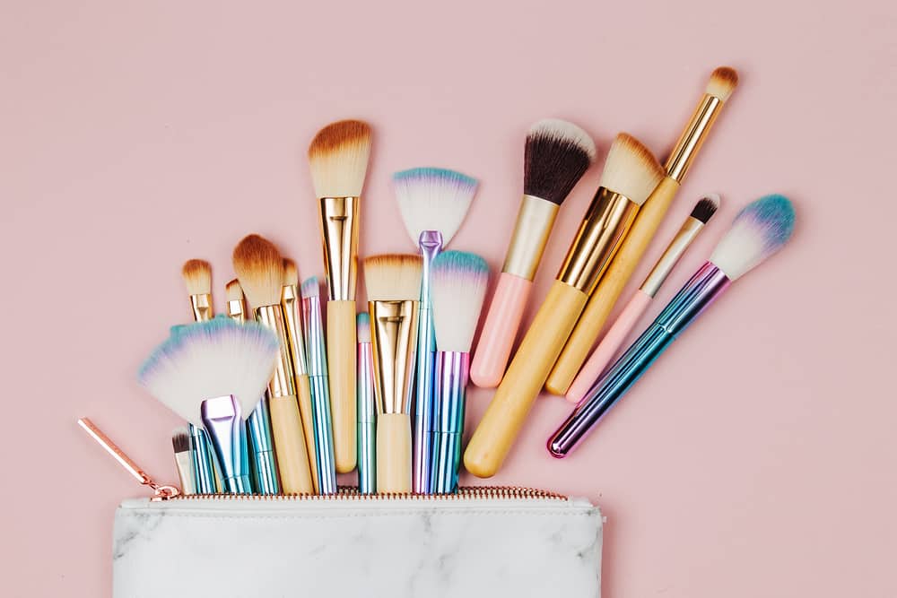 <p>When we first started traveling all the time, I tried dozens of different travel sized makeup brushes, trying to find the perfect ones. I have found that travel sized makeup brushes annoy me. They are too small, and I end up being heavy handed because I can’t hold them where I want to.</p><p>I’ve given up on tiny makeup brushes. I have just pared down brushes to what I absolutely need. Even the full sized brushes take up the same amount of room as the collection of travel sized ones I hated and didn’t use!</p><p>I take two eyeshadow brushes, a tapered brush for powder, a small blending/foundation brush and an eyelash curler. Nothing more.</p><p>I use my small blending brush for foundation, a fluffy shadow brush and a detailed shadow brush for my eyes, and a tapered/angled brush to tap on powder or add a bit of bronzer. I use my fingers to apply blush and the lipstick applicator for lipstick.</p>