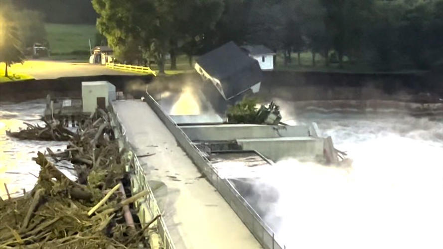 Video shows moment house collapses into river near failing dam