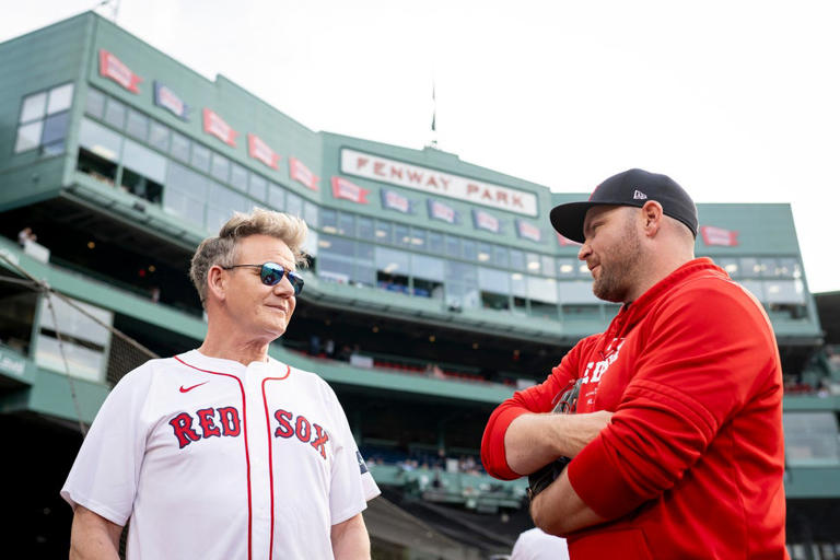 Gordon Ramsay chatted with Liam Hendriks of the Boston Red Sox before throwing a ceremonial first pitch on June 25. Maddie Malhotra/Boston Red Sox/Getty Images
