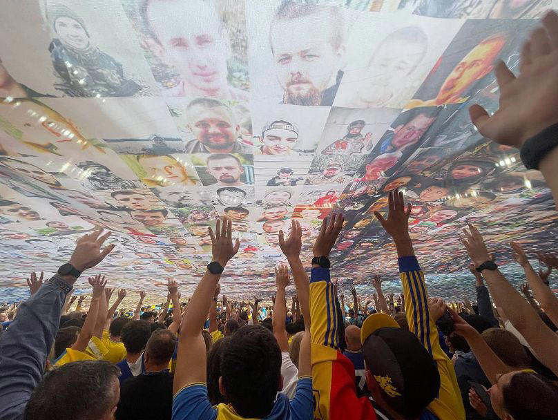 'peace has a price': football fans display mosaic of fallen ukrainian soldiers at euro 2024 match