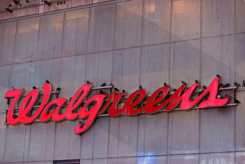 walgreens cuts profit view, looks to shut more stores as spending slows