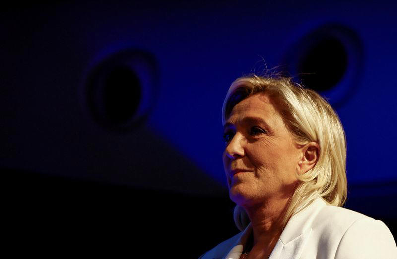 france's le pen expects clear far-right win and power over macron
