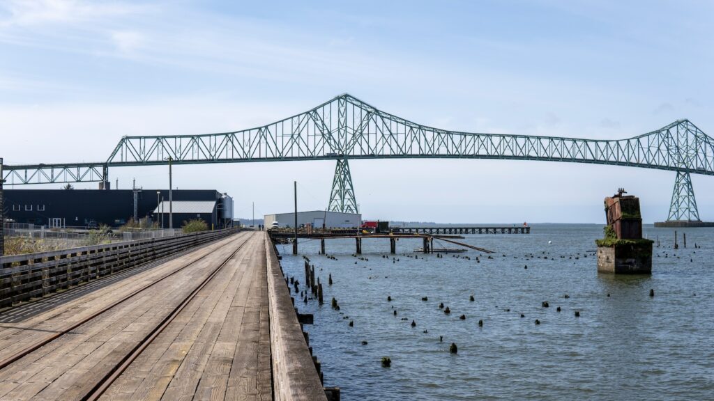 <p>One of our favorite towns in all of Oregon, Astoria sits only 90 minutes from Portland which makes it the perfect distance for a day trip.</p><p>Here there are plenty of <a href="https://roamthenorthwest.com/things-to-do-in-astoria-with-kids/">things to do</a> like climb the Astoria Tower (don’t forget to grab a glider before you head up the stairs) for stunning view of the Columbia as it flows out to the Pacific Ocean, walk the waterfront trail, or check out the numerous breweries that call Astoria home.</p><p>When you’re ready for a bite to eat head over to the famous Bowpicker which serves tasty fish & chips out of an old fishing boat. Just make sure to bring cash as they don’t accept credit or debit cards.</p>