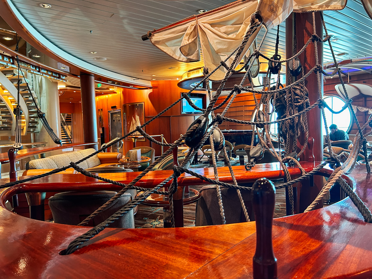 <p>Schooners Bar is one of the best bars on Royal Caribbean. It always has a singer singing American Song Book-type songs and hosts quizzes every night. We didn’t love the singer on this sailing. But that aside, the quizzes and cocktails were as great as always. </p>