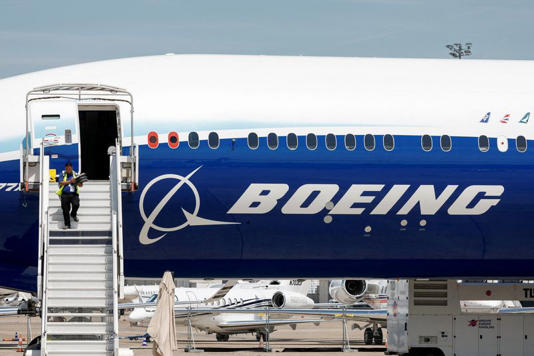 FILE PHOTO: A Boeing logo is seen on a 777-9 aircraft on display during the 54th International Paris Airshow at Le Bourget Airport near Paris, France, June 18, 2023. REUTERS/Benoit Tessier/File Photo