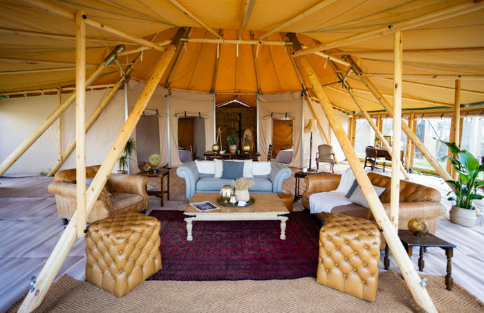 inside glastonbury's poshest campsite with chic interiors, a concierge, spa and pool