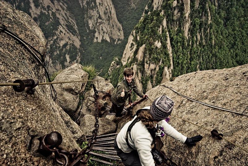 <p><strong>Location: </strong>China</p>  <p>The Mount Huashan Plank walk is considered <strong>"the most dangerous hiking trail in the world"</strong>—and for good reason. Constructed over 700 years ago, visitors scale the mountain by walking along a path made of very narrow wooden planks. But that's not all.</p>