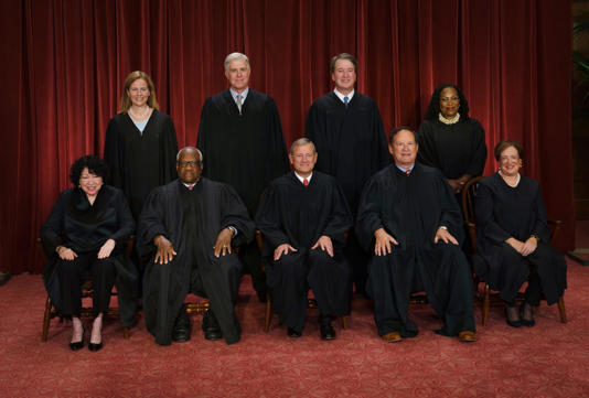 The Supreme Court from left, Justices Sonia Sotomayor, Amy Coney Barrett, Clarence Thomas and Neil Gorsuch, Chief Justice John Roberts, and Justices Brett Kavanaugh, Samuel Alito, Ketanji Brown Jackson and Elena Kagan.