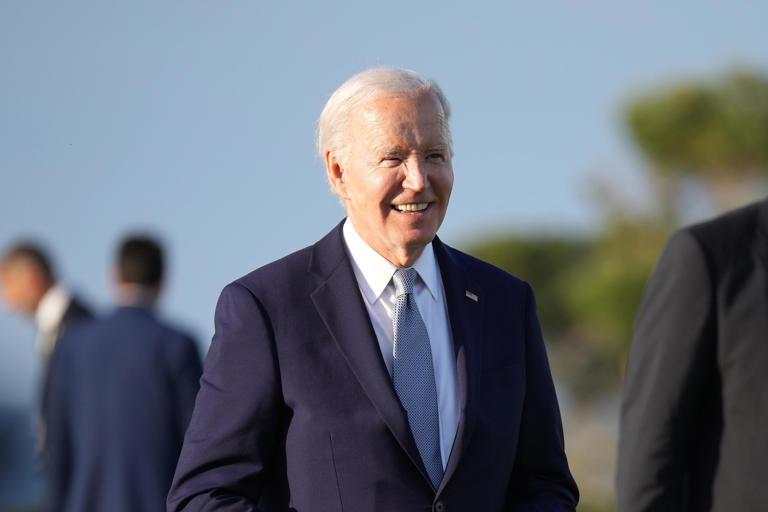 President Joe Biden joins G7 leaders as they gather to watch a parachute drop at San Domenico Golf Club during day one of the 50th G7 summit on June 13, 2024, in Fasano, Italy. A video was shared online of Biden druin the skydiving demonstration that critics say show him "wander" away from the rest of the G7 officials.