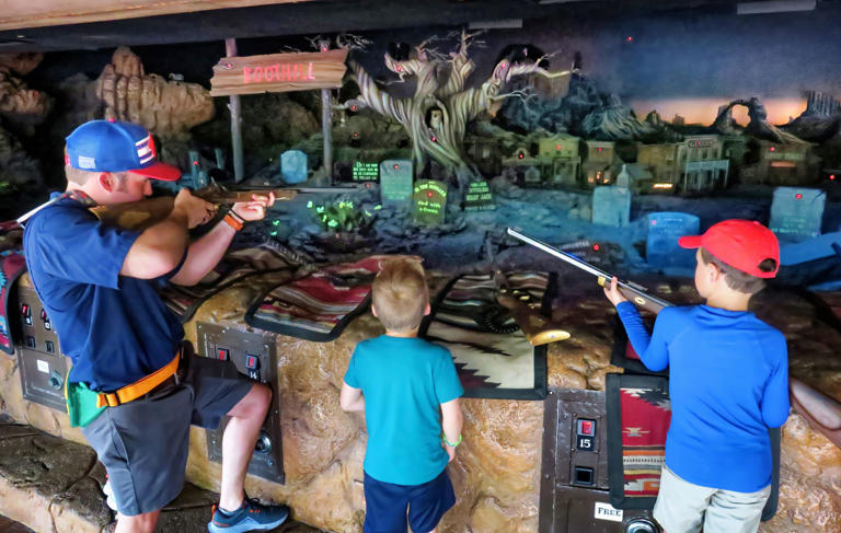 Guests take their shots at the Frontierland Shootin' Arcade in the Magic Kingdom at Walt Disney World, Tuesday, April 30, 2024. Disney Co. has not yet announced plans to close the shooting gallery, but rumors of the demise of the attraction —that opened with the park in 1971— have been circulating for months.