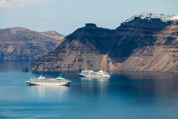 Santorini island, Greece - Cruise ships near the coast.