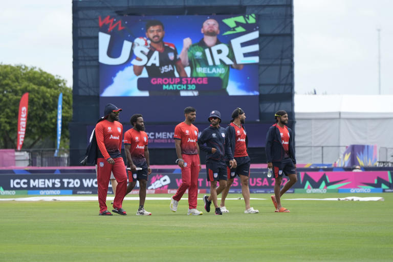 Team United States' cricketers walk in the field before an ICC Men's T20 World Cup cricket match between the United States and Ireland at the Central Broward Regional Park Stadium in Lauderhill, Fla., Friday, June 14, 2024. (AP Photo/Lynne Sladky)