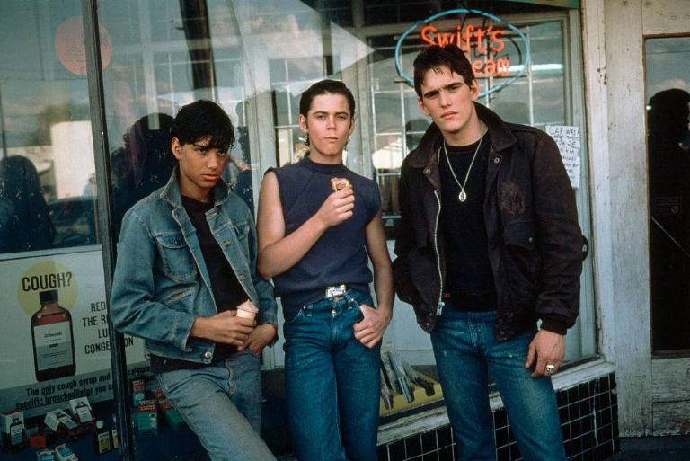 <p>An adaptation of S.E. Hinton's 1967 novel of the same name, <i>The Outsiders </i>is a 1983 coming-of-age film about a rivalry between "The Socs" and "The Greasers," two gangs separated by social class, and the consequences that follow when one member murders the other. Directed by the renowned Francis Ford Coppola, the film is particularly notable for its up-and-coming ensemble cast, including C. Thomas Howell, Rob Lowe, Tom Cruise, Matt Dillon, Patrick Swayze, Ralph Macchio, Emilio Estevez, and Patrick Swayze. </p> <p>The film was well-received upon its initial release and is today considered a classic. Continue reading to find out everything you need to know about the movie!</p>