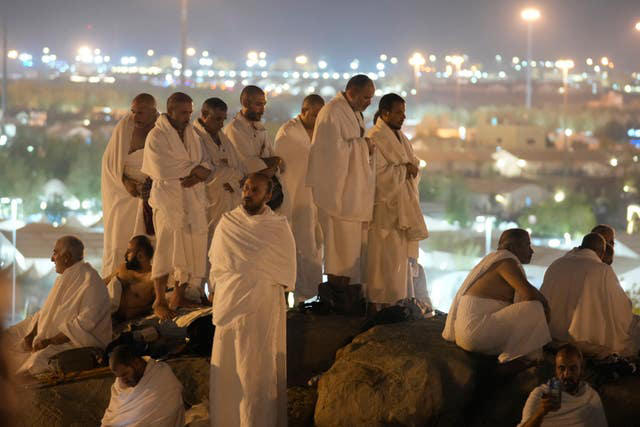 muslim pilgrims converge at mount arafat for worship as hajj reaches its peak