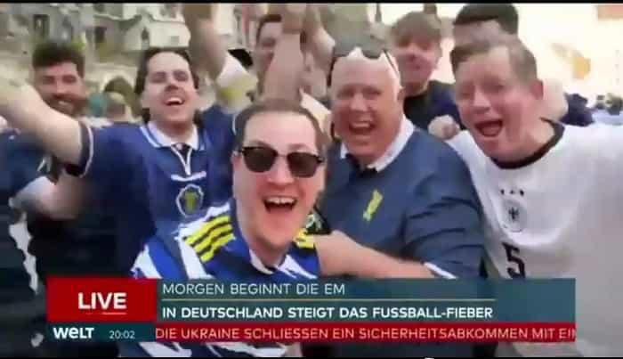 een duitse journalist staat voor een gênant moment live op televisie na een grap van een schotse fan tijdens de dekking van euro 2024