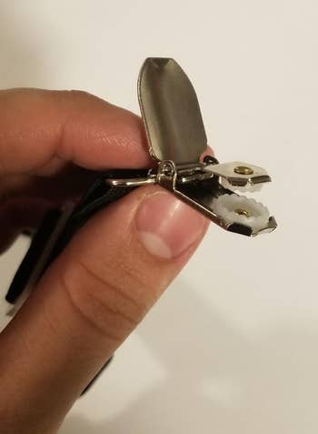 a reviewer holding one of the clips