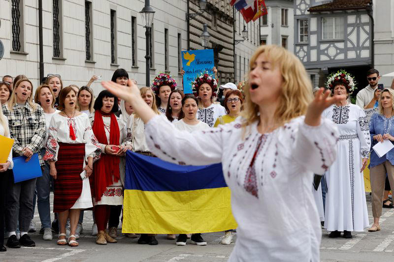 ukrainian refugees sing beethoven's 'ode to joy' near swiss summit