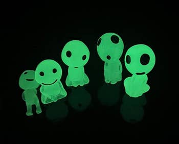 six glowing alien figurines