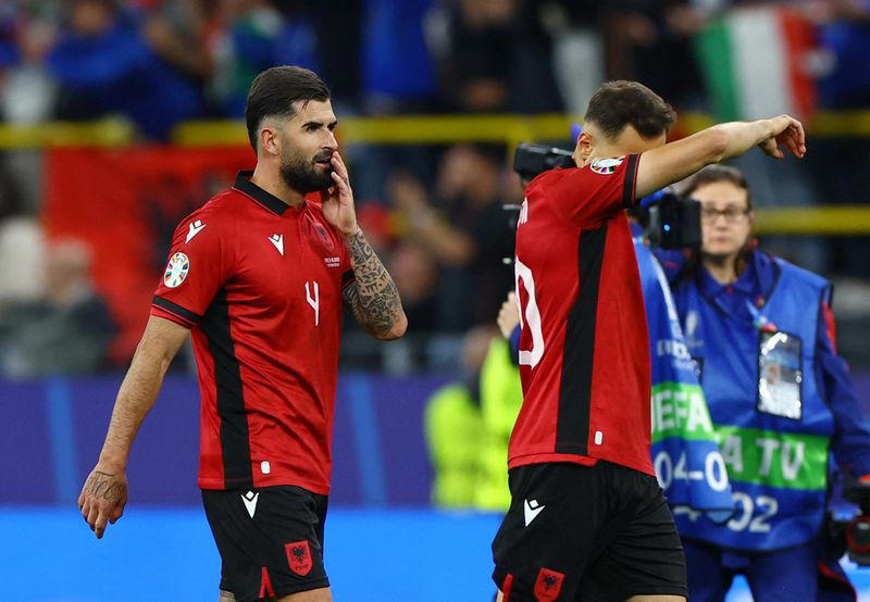 soccer-italy see off albania after record early scare