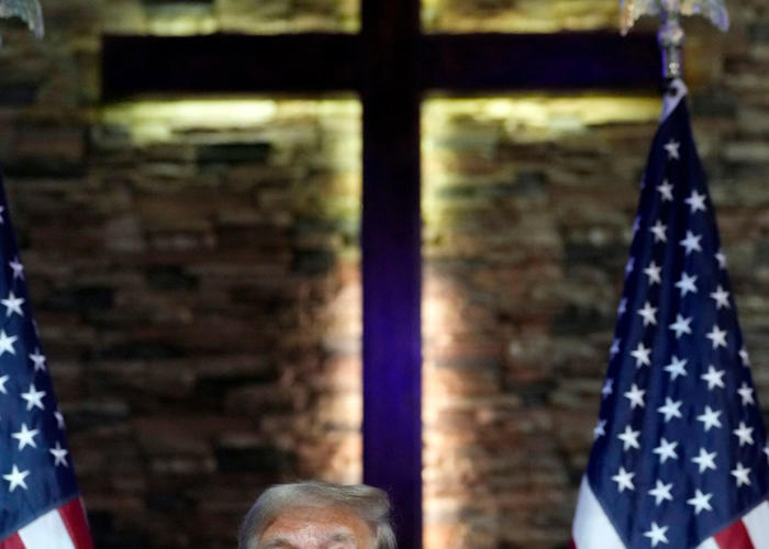 trump blames immigrants for taking jobs as he courts voters at a black church